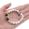 Bratara pentru barbati Howlit, Onix mat si 3 banuti de Hematit auriu pe elastic, 8-9mm, imagine 4