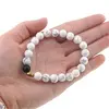Bratara pentru barbati Howlit, Onix mat si banut de Hematit auriu pe elastic, 8-9mm, imagine 4