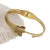 Bratara din cupru placat cu aur galben 18k fixa, model fluture cu trei randuri, imagine 3