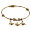 Bratara din cupru placat cu aur galben 18k fixa, model snake cu charm fluturasi, imagine 2
