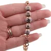 Bratara din cupru placat cu aur roz 18k, model cercuri cu zirconii multicolore, imagine 3