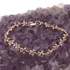 Bratara din cupru placat cu aur roz 18k, model flori cu zirconii multicolore, imagine 2