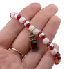 Bratara pe elastic cu margele albe, rosii si charm sticla de parfum, imagine 3