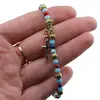 Bratara pe elastic cu margele multicolore, elemente aurii si cruce charm, imagine 3