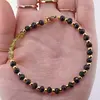 Bratara Turmalina neagra discuri fatetate 4-5mm si Peridot banuti 3-4mm cu bumbi aurii, imagine 3