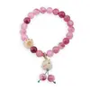 Bratara pe elastic cu Agat roz sfere 8mm si charm Maneki Neko