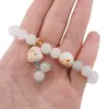 Bratara pe elastic cu Cuart gri deschis sfere 8mm si charm Maneki Neko, imagine 3