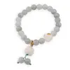 Bratara pe elastic cu Cuart gri sfere 8mm si charm Maneki Neko