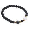 Bratara Onix negru mat sfere 6mm, Larvikit 8mm si steluta din Sidef 10mm cu bumbi aurii