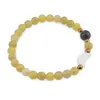 Bratara Jad olive sfere 6mm, Larvikit 8mm si luna din Sidef 12mm cu bumbi aurii