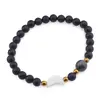Bratara Onix mat sfere 6mm, Larvikit 8mm si luna din Sidef 12mm cu bumbi aurii