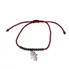 Bratara pe snur rosu, model Hamsa