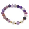 Bratara pe elastic Perle de cultura, bumbi aurii si Agat mov dantelat sfere mate 8mm