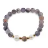 Bratara pe elastic Perle de cultura, bumbi aurii si Agat mov mat sfere 8mm