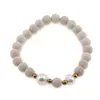 Bratara pe elastic Perle de cultura, bumbi aurii si Jasp fosilic sfere 8mm