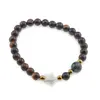Bratara mix Ochi de tigru si Ochi de taur sfere 6mm, Larvikit 8mm si steluta din Sidef 10mm cu bumbi aurii