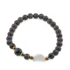 Bratara Obsidian fulg de nea maro sfere 6mm, Larvikit 8mm si luna din Sidef 12mm cu bumbi aurii