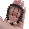 Bratara pe elastic Perle de cultura, bumbi aurii si Agat football negru sfere 8mm, imagine 4
