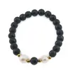 Bratara pe elastic Perle de cultura, bumbi aurii si Agat football negru sfere 8mm