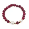 Bratara pe elastic Perle de cultura, bumbi aurii si Agat roz sfere fatetate 8mm