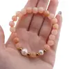 Bratara pe elastic Perle de cultura, bumbi aurii si Cuart piersica sfere 8mm, imagine 4