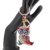 Breloc auriu bufnita emailata cu pene rosii si ochi protectori, 12cm, imagine 2