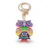 Breloc auriu bufnita emailata multicolora si ochi protectori, 12cm