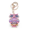 Breloc auriu bufnita emailata roz si ochi protectori, 12cm