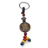 Breloc tibetan rotund cu model Kalachakra, margele rosii galbene albastre, 14cm