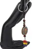 Breloc tibetan rotund cu model lotus, margele rosii galbene albastre, 14cm, imagine 2