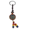 Breloc tibetan rotund cu model mantra, margele rosii galbene albastre, 14cm