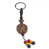 Breloc tibetan rotund cu model OM, margele rosii galbene albastre, 14cm