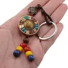 Breloc tibetan rotund cu model scoica aurie, margele rosii galbene albastre, 14cm, imagine 3