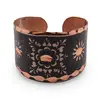 Inel reglabil din cupru cu motive florale pe fundal negru, 15mm