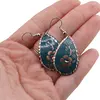 Cercei din cupru lacrima, model floare ornament pe fundal turcoaz, imagine 3