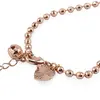 Bratara din cupru placat cu aur roz 18k, sfere fatetate cu charm inima si clopotel, imagine 2