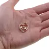 Pandantiv din cupru placat cu aur roz 18k, model inima cu zirconii si semnul iubirii, imagine 3