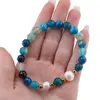 Bratara pe elastic Perle de cultura, bumbi aurii si Agat albastru dantelat sfere fatetate 8mm, imagine 3
