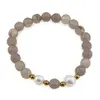Bratara pe elastic Perle de cultura, bumbi aurii si Agat gri sfere fatetate 8mm
