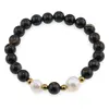 Bratara pe elastic Perle de cultura, bumbi aurii si Agat negru sfere 8mm