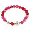 Bratara pe elastic Perle de cultura, bumbi aurii si Agat roz sfere 8mm
