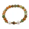 Bratara pe elastic Perle de cultura, bumbi aurii si Agat verde cu galben sfere fatetate 8mm