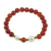 Bratara pe elastic Perle de cultura, bumbi aurii si Carneol sfere 8mm