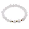 Bratara pe elastic Perle de cultura, bumbi aurii si Cuart roz sfere fatetate 8mm