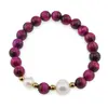 Bratara pe elastic Perle de cultura, bumbi aurii si Ochi de tigru roz sfere 8mm