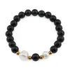 Bratara pe elastic Perle de cultura, bumbi aurii si Onix sfere 8mm
