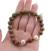 Bratara pe elastic Perle de cultura, bumbi aurii si Unakit sfere 8mm, imagine 3