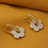 Cercei din cupru placat cu aur galben 18k, model accesoriu floare cu zirconii, imagine 2