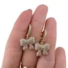 Cercei din cupru placat cu aur galben 18k, model fundita cu zirconii, imagine 3