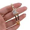 Bratara cupru placat cu aur galben 18k cu fluture si zirconii centrale incrustate, imagine 3